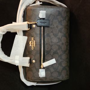 Small hand/shoulder duffle coach bag. NWT. 10.5 width 7.5 length.